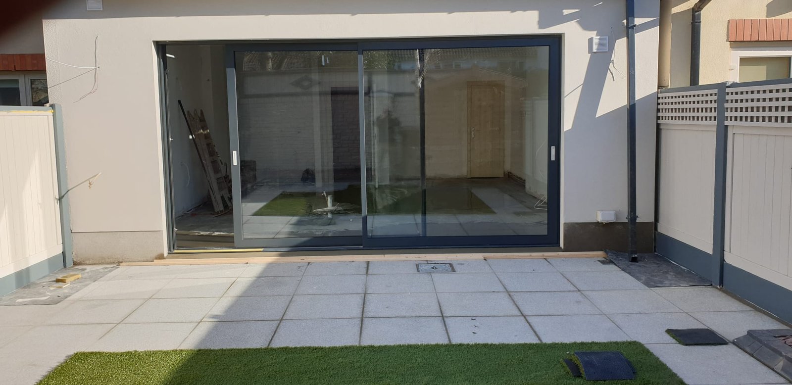 Modern patio with large black bi-fold doors