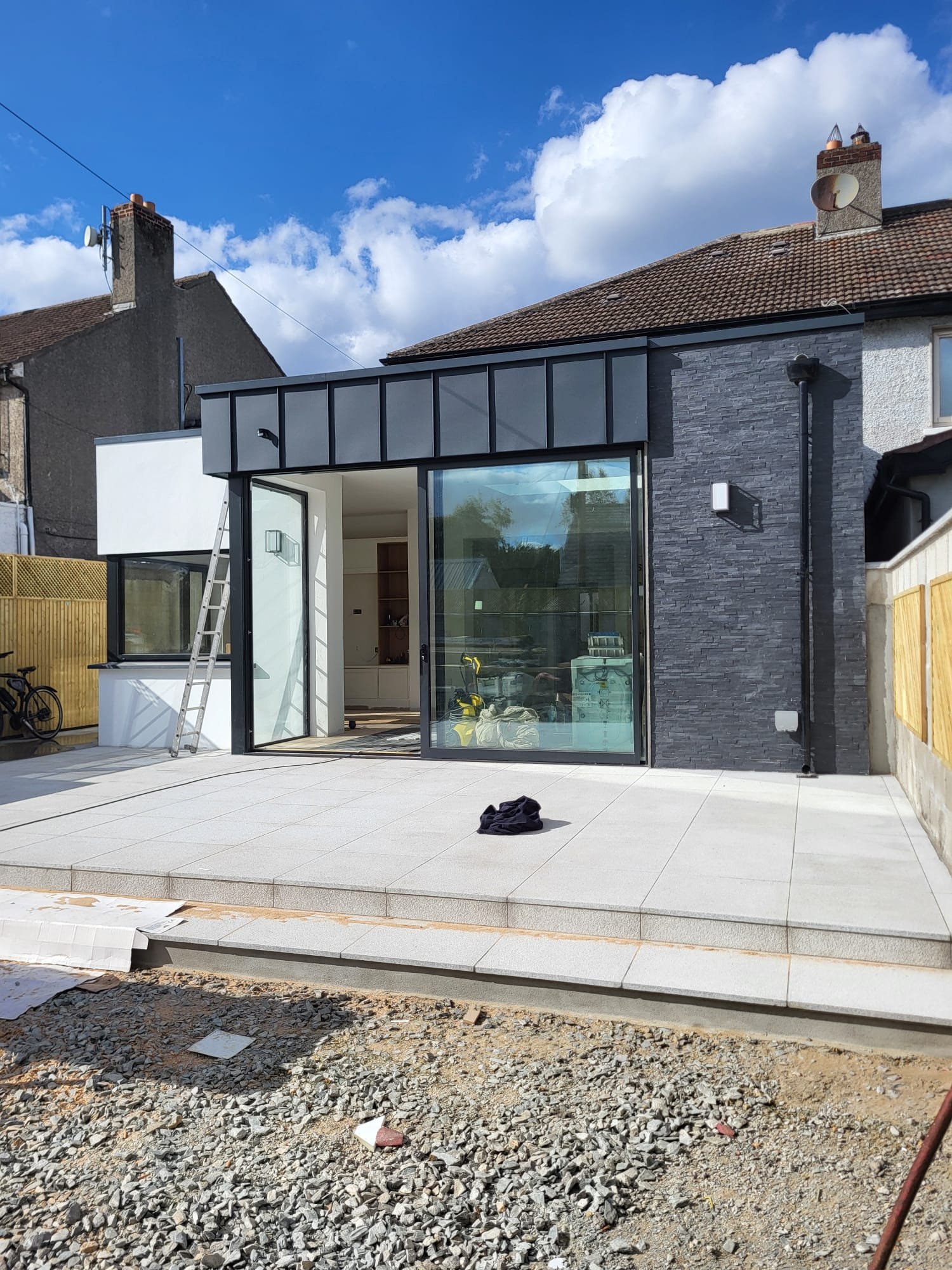 Modern house extension with large black bi-fold doors