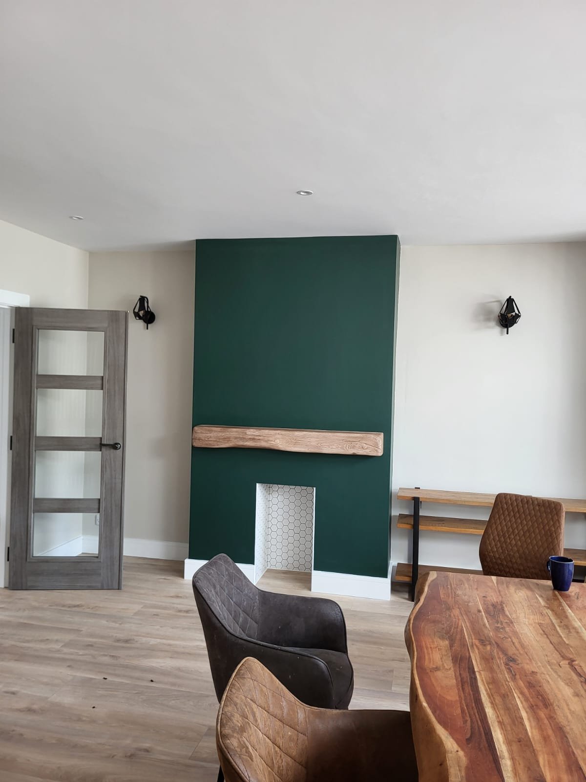 Dining room with green accent wall