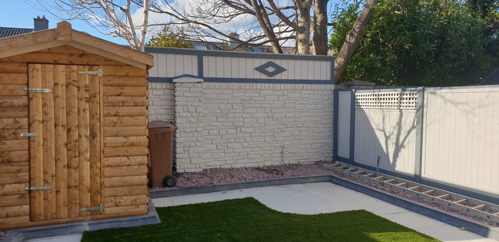 Outdoor garden area with wooden shed