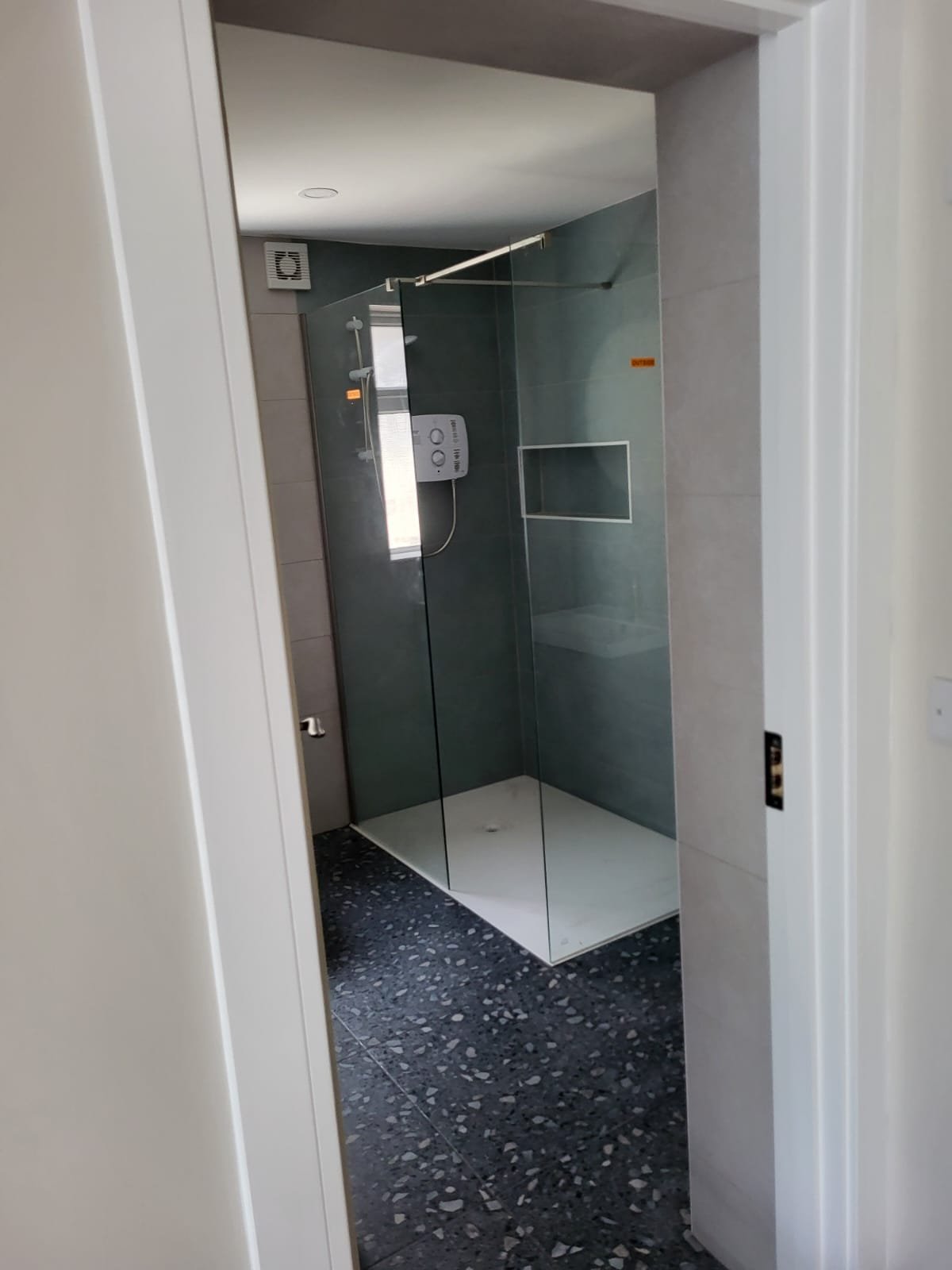 Modern bathroom with green tile