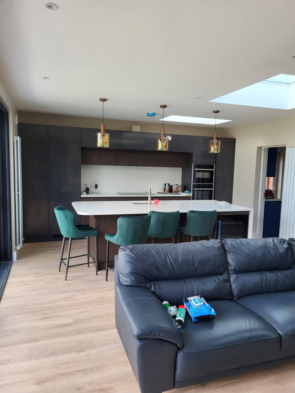 Kitchen with teal bar stools