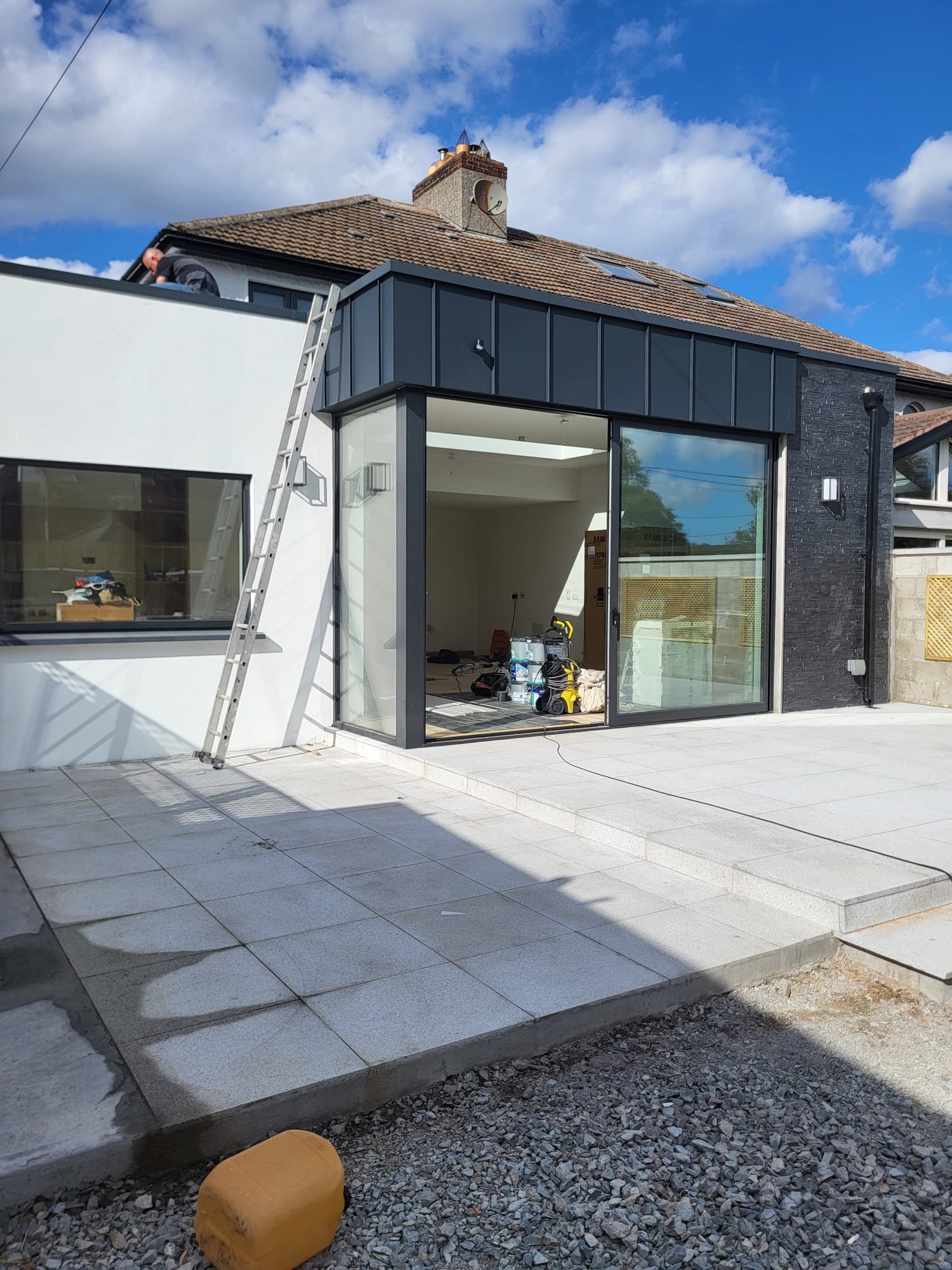 Modern house extension with black bi-fold doors