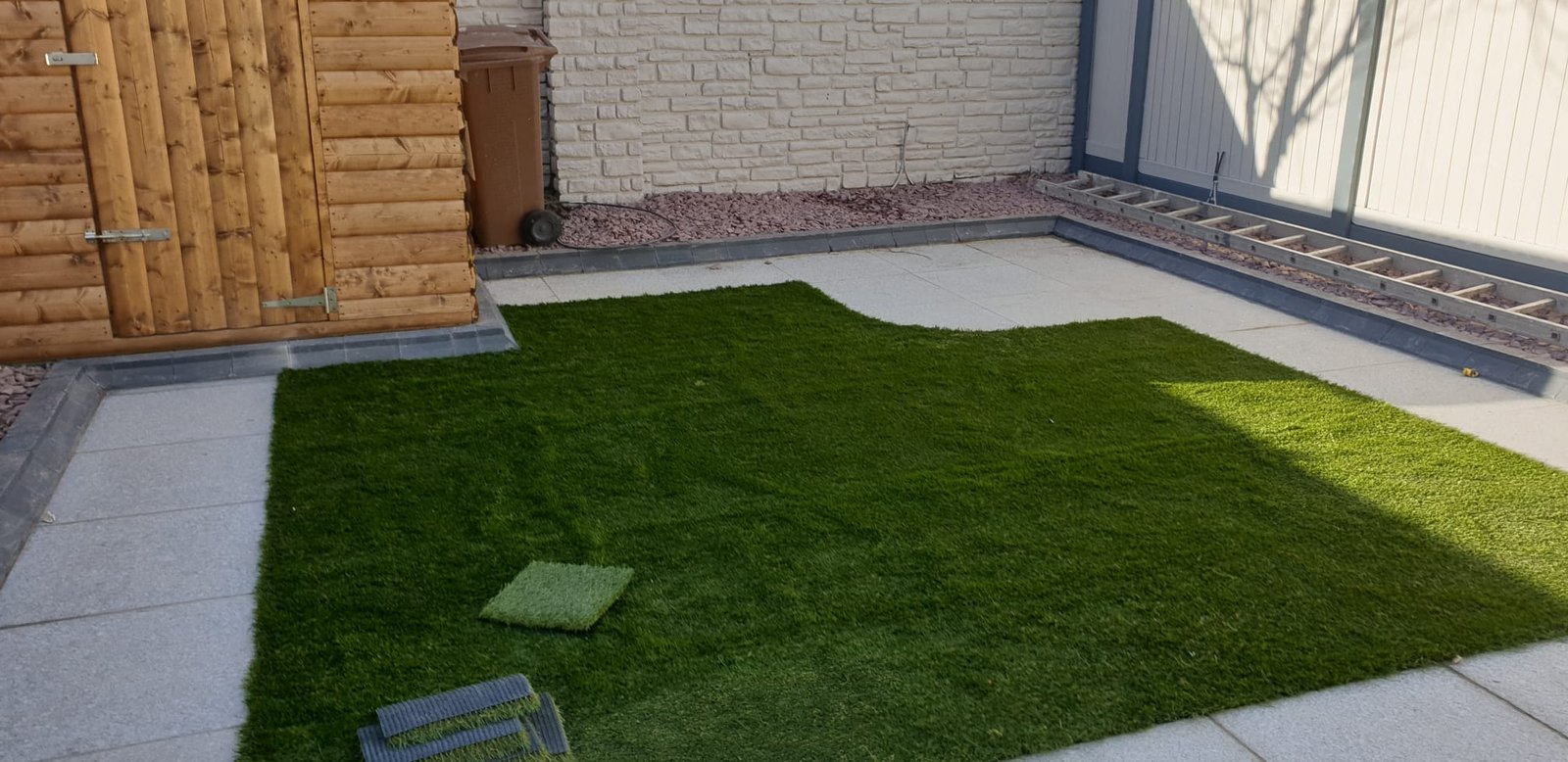 Outdoor garden with white fence