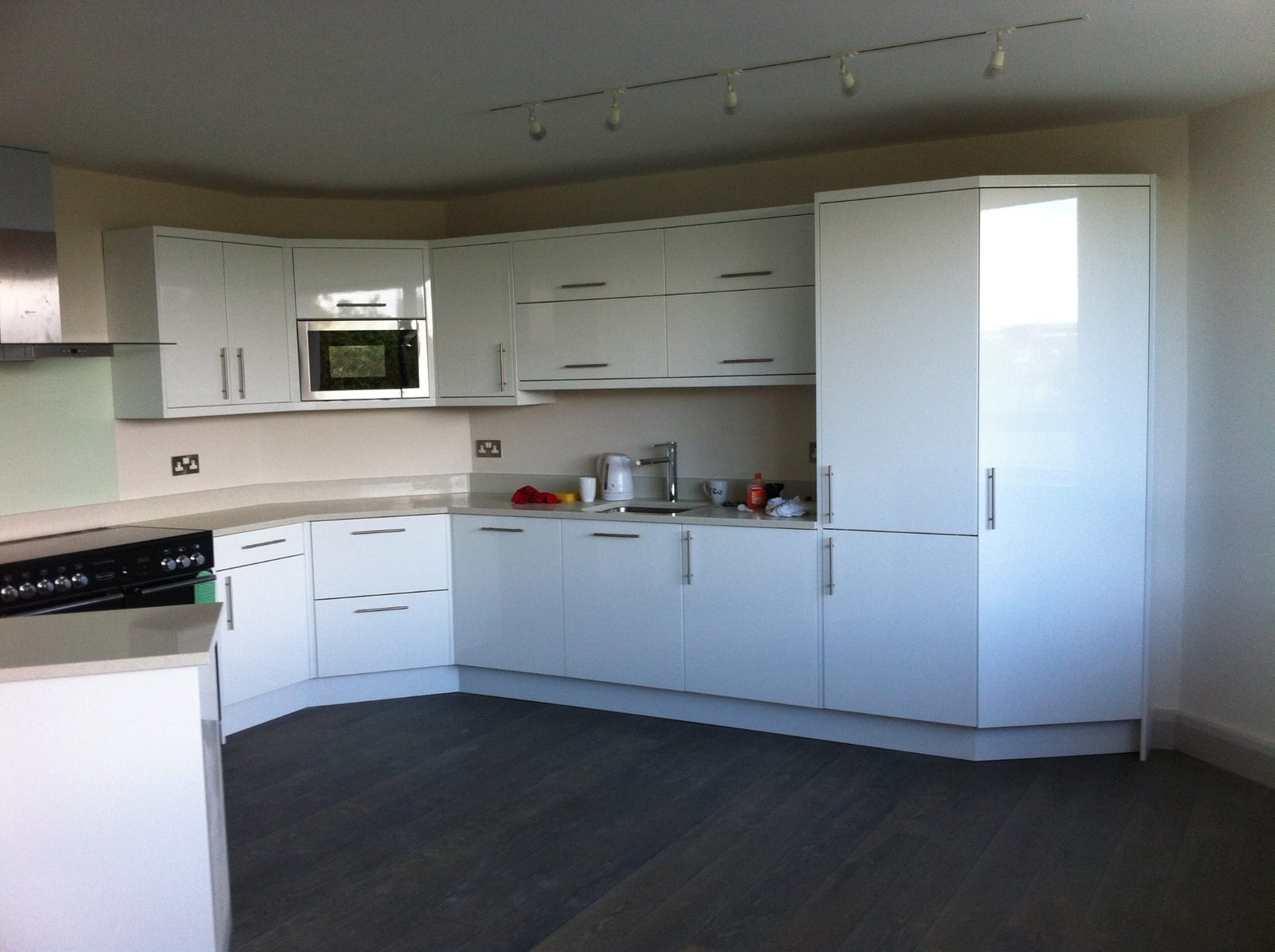 Modern white kitchen with curved design