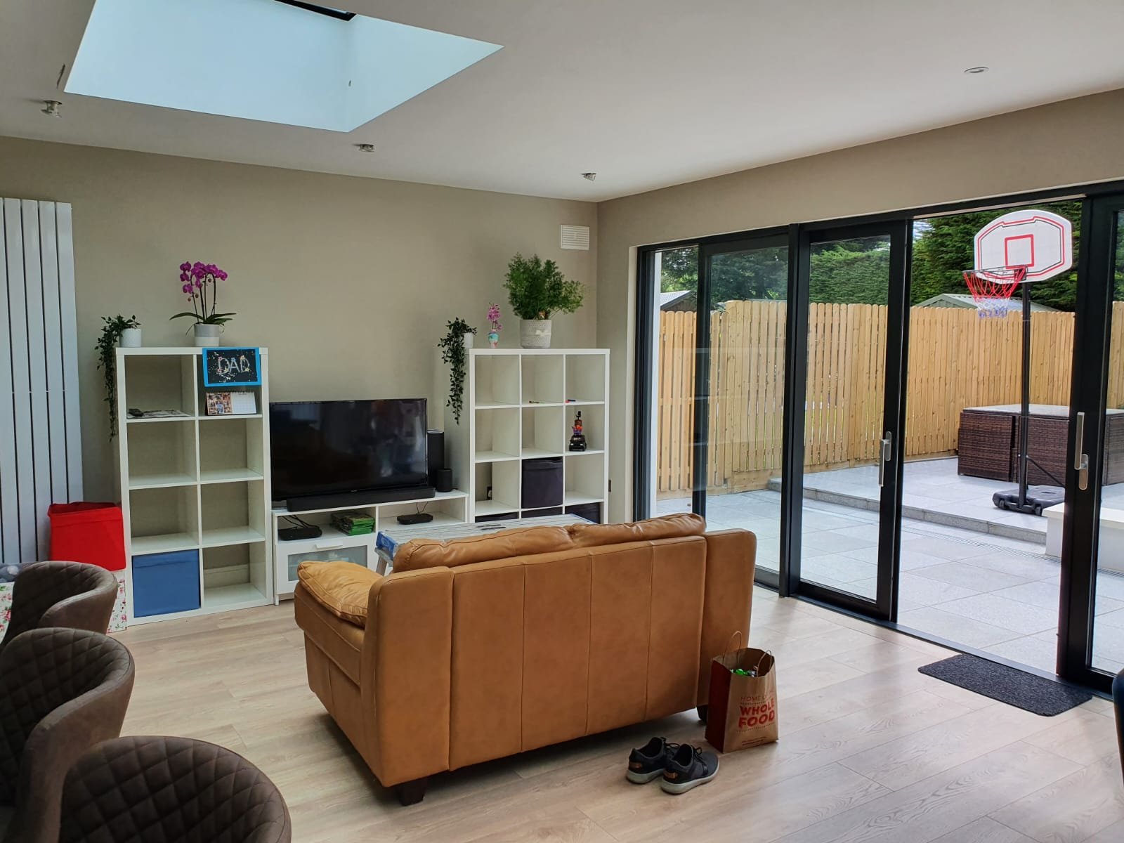 Modern living room with brown leather sofa