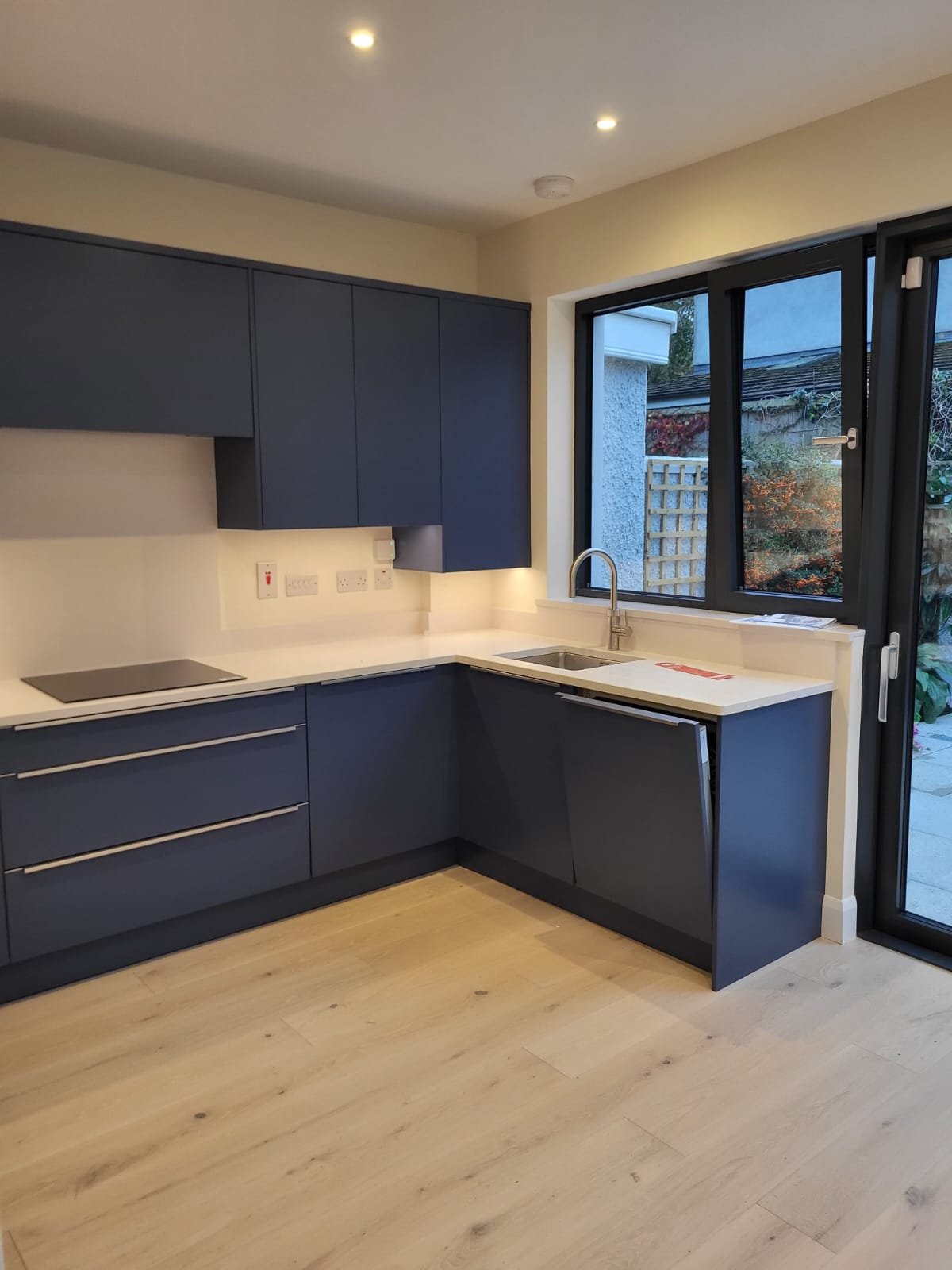 Modern kitchen with dark navy cabinetry