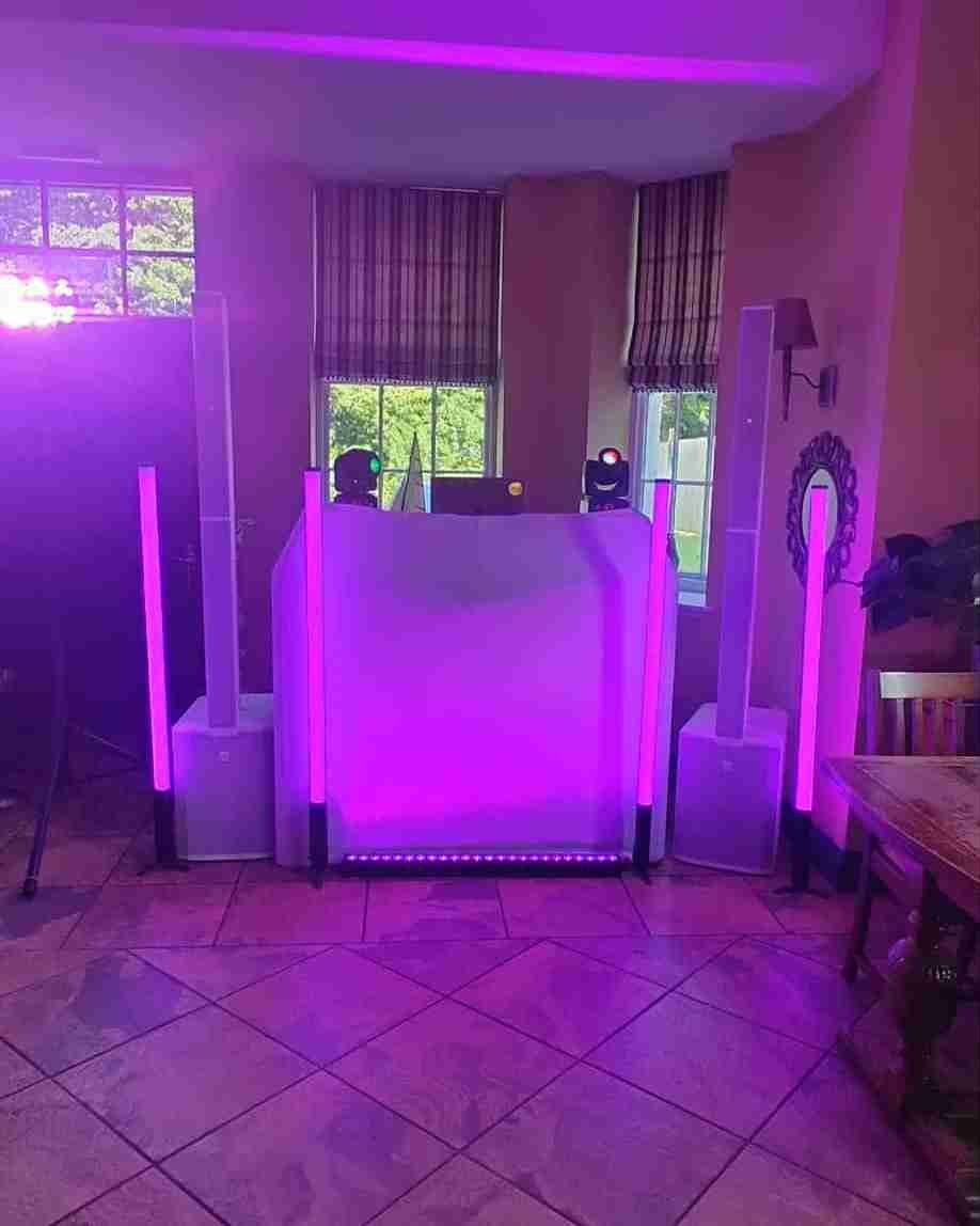 Couple enjoying their first dance with elegant blue lighting