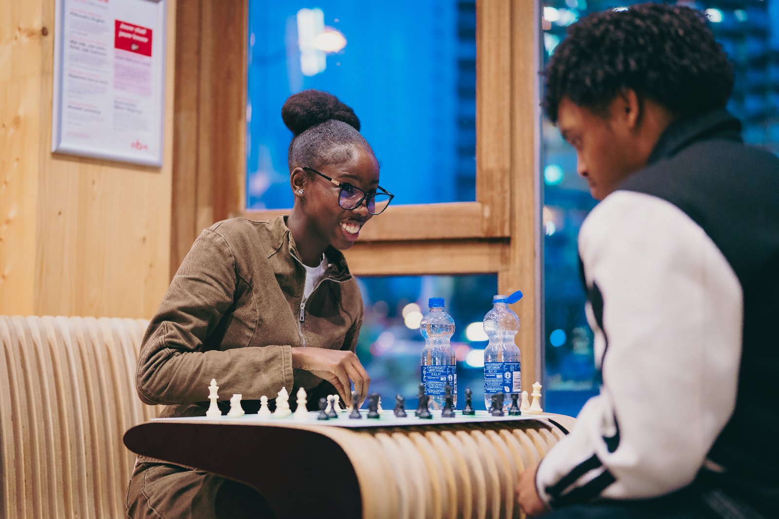 Two young people playing chess