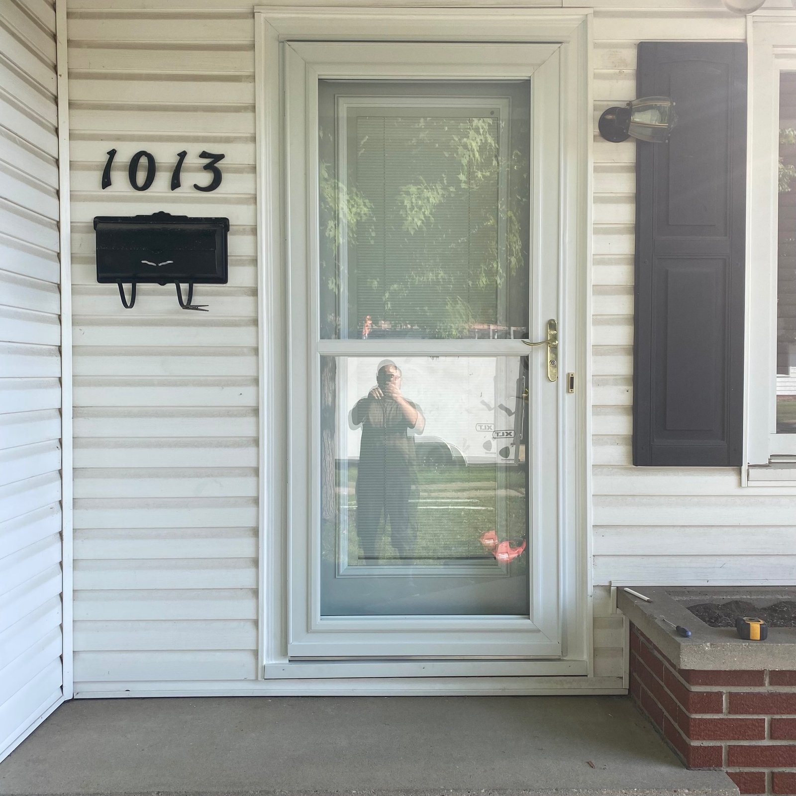 New exterior door and storm door installed on a Wisconsin home
