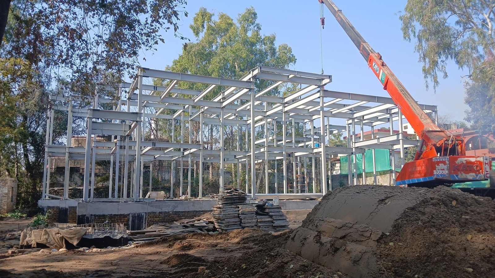Structural steel frame erection with crane on the Sector G-6 Islamabad SCIP residence site
