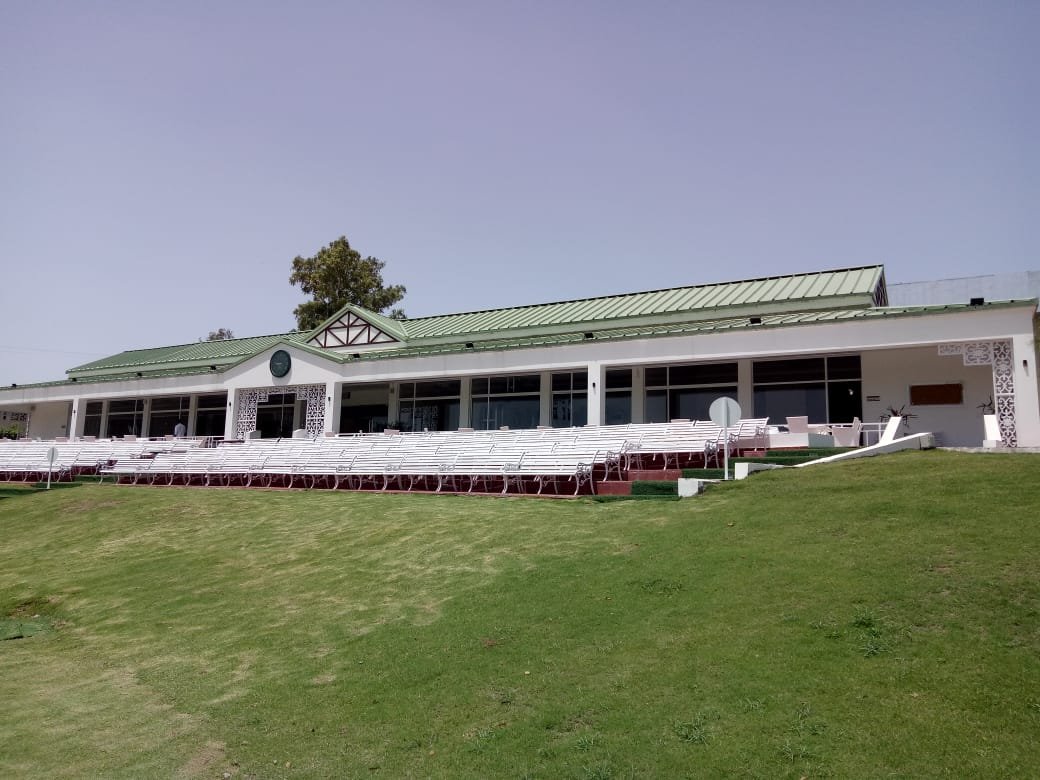 Front view of the cricket pavilion across the grass field