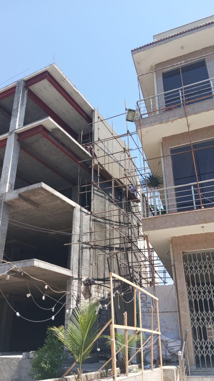 Scaffolding and concrete floors during Ali Centre multi-story construction