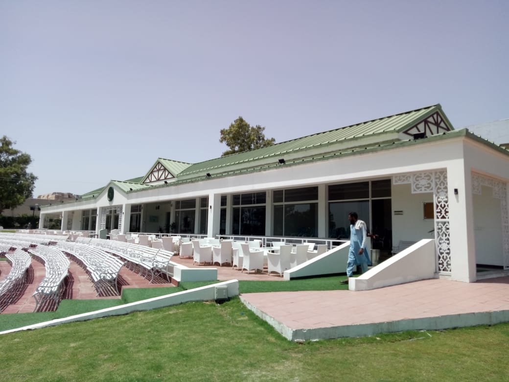Cricket pavilion facade and seating area on the field