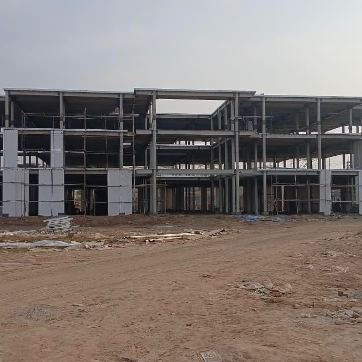 Multi-storey steel building frame under construction in daylight