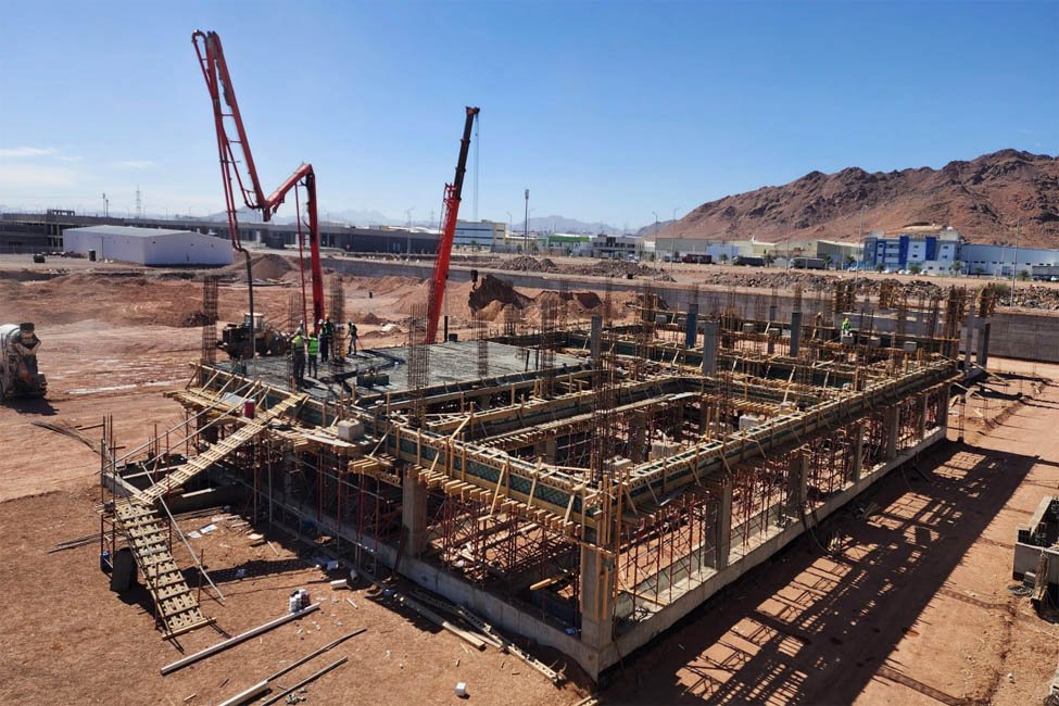Steel frame under construction at a desert-site building project