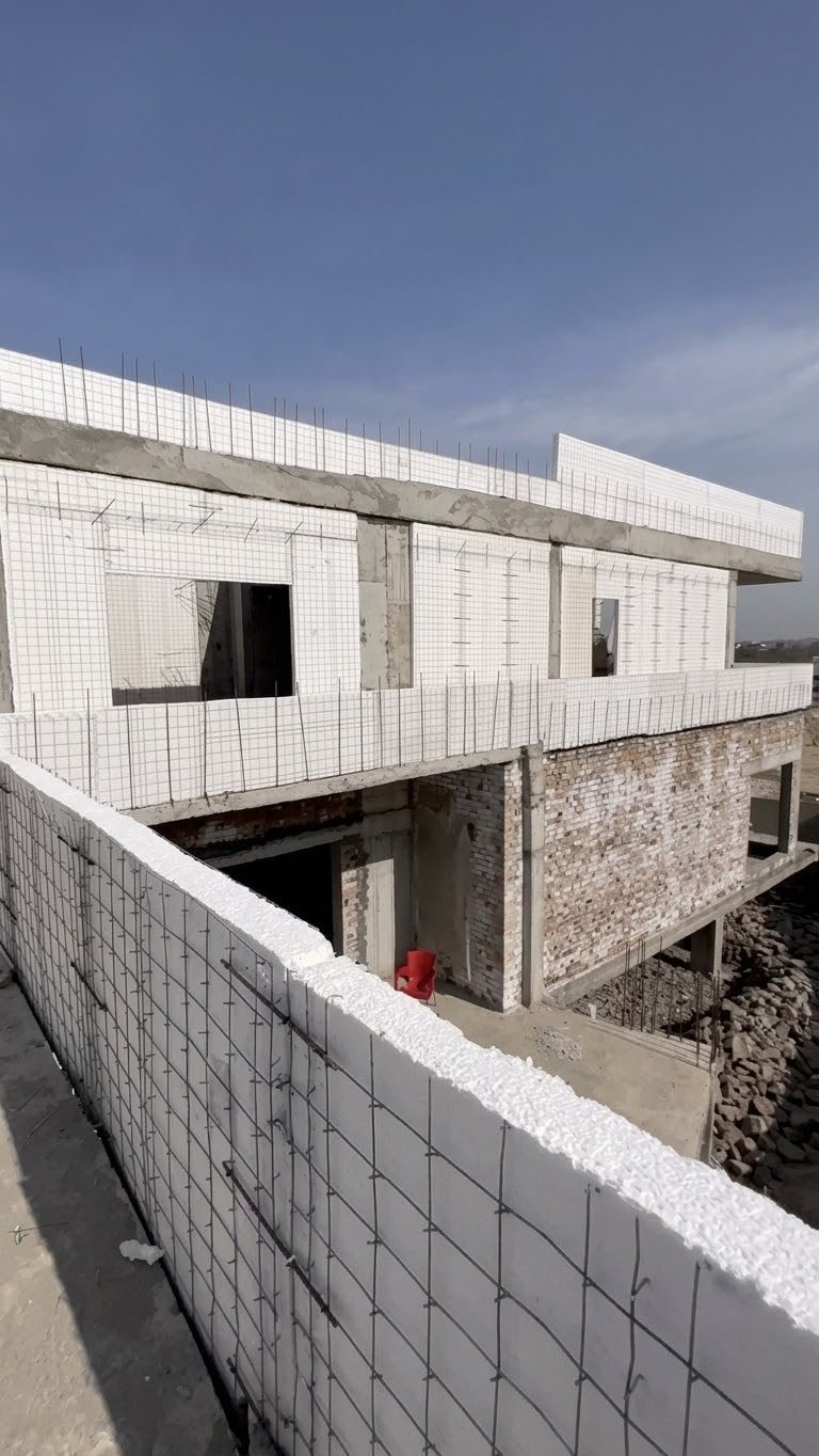 White SCIP wire-mesh panels fixed across the farmhouse upper floors