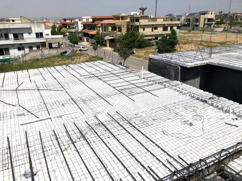 Stack of 3D welded wire panels with foam cores in a warehouse