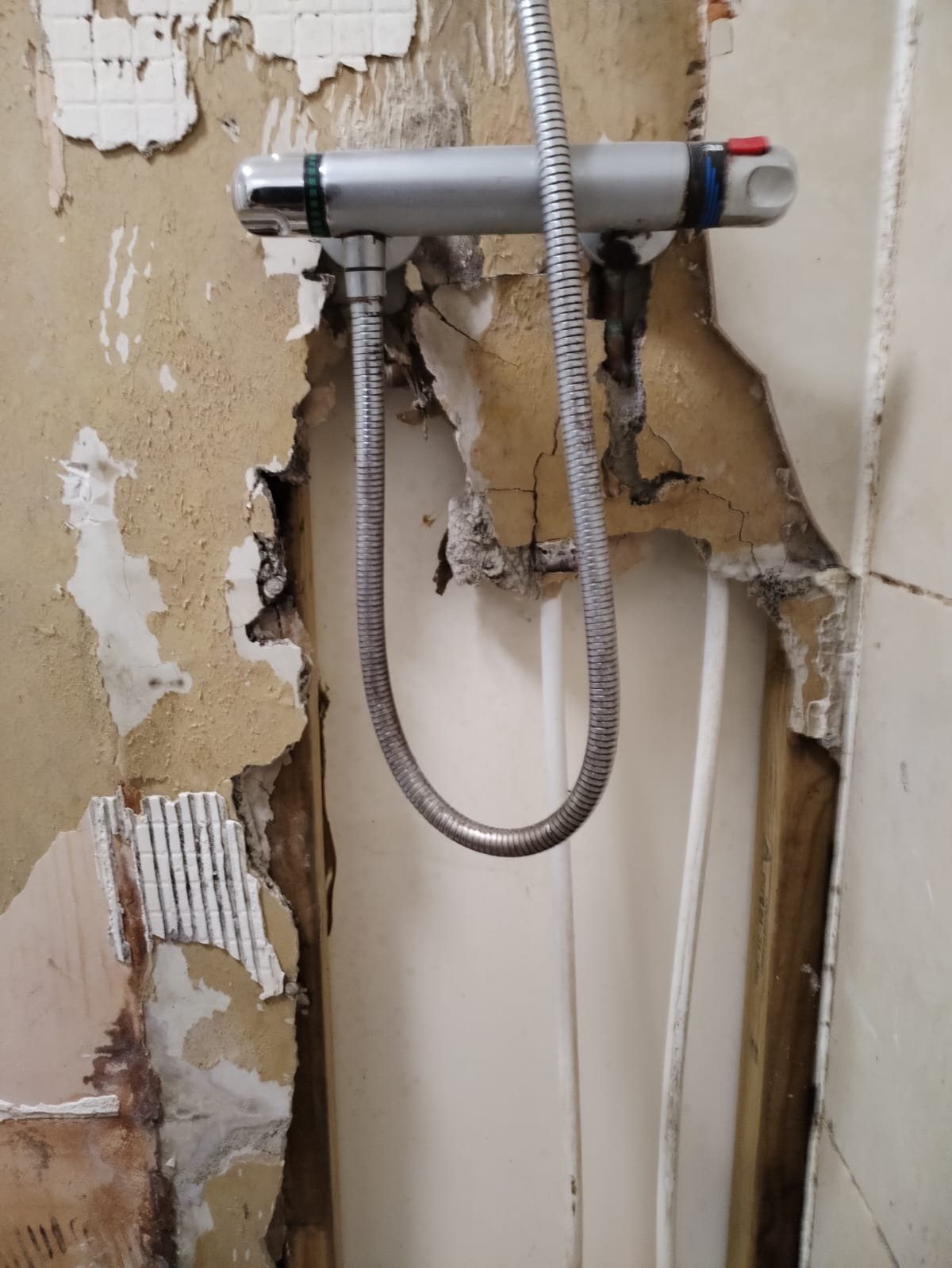 Bathroom renovation in progress with construction work underway