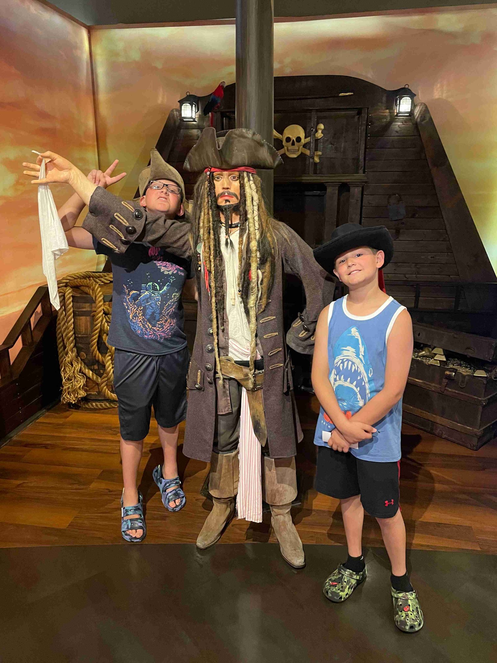 Boys posing with Jack Sparrow wax figure