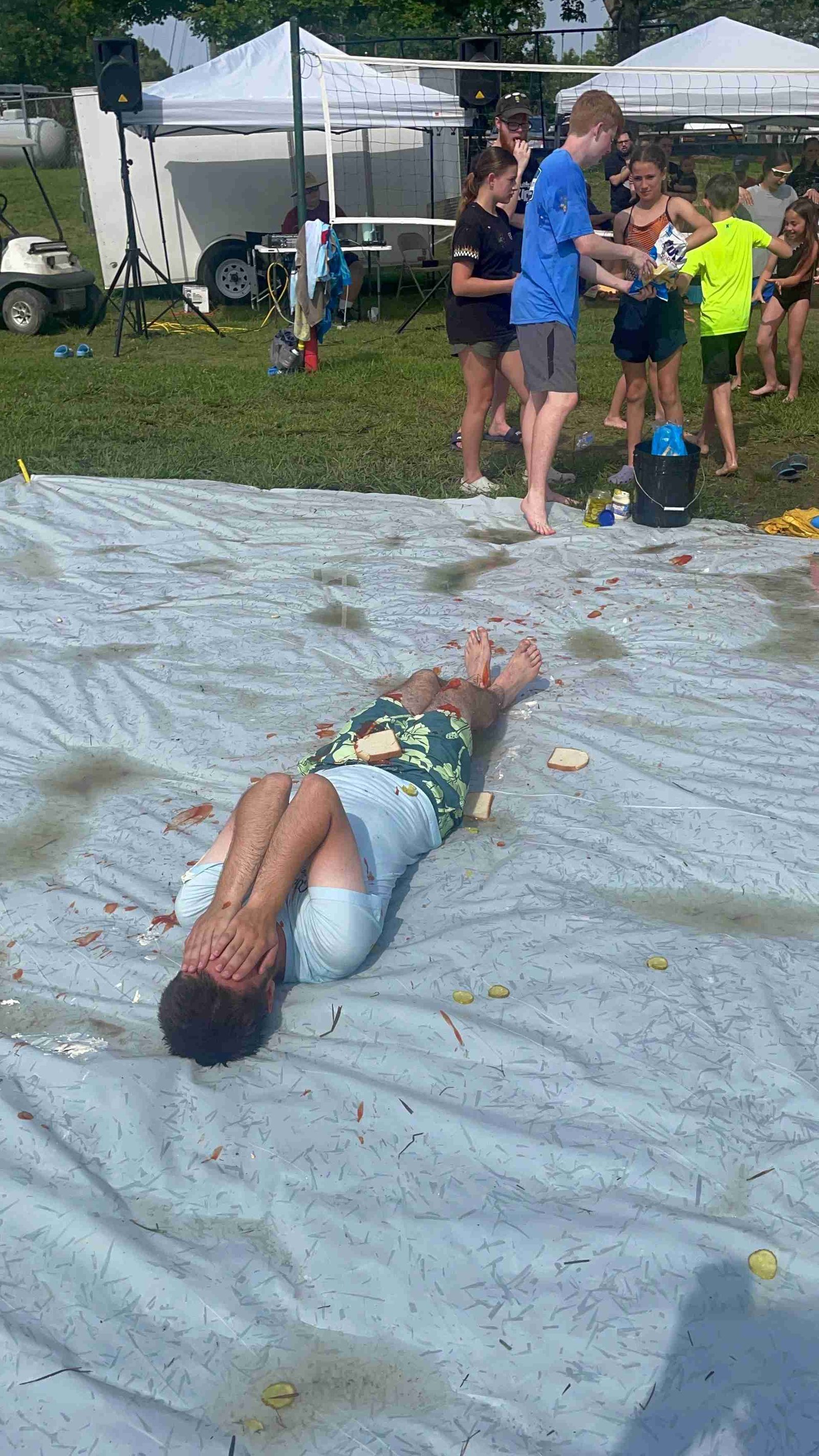 Youth enjoying slip and slide water activity