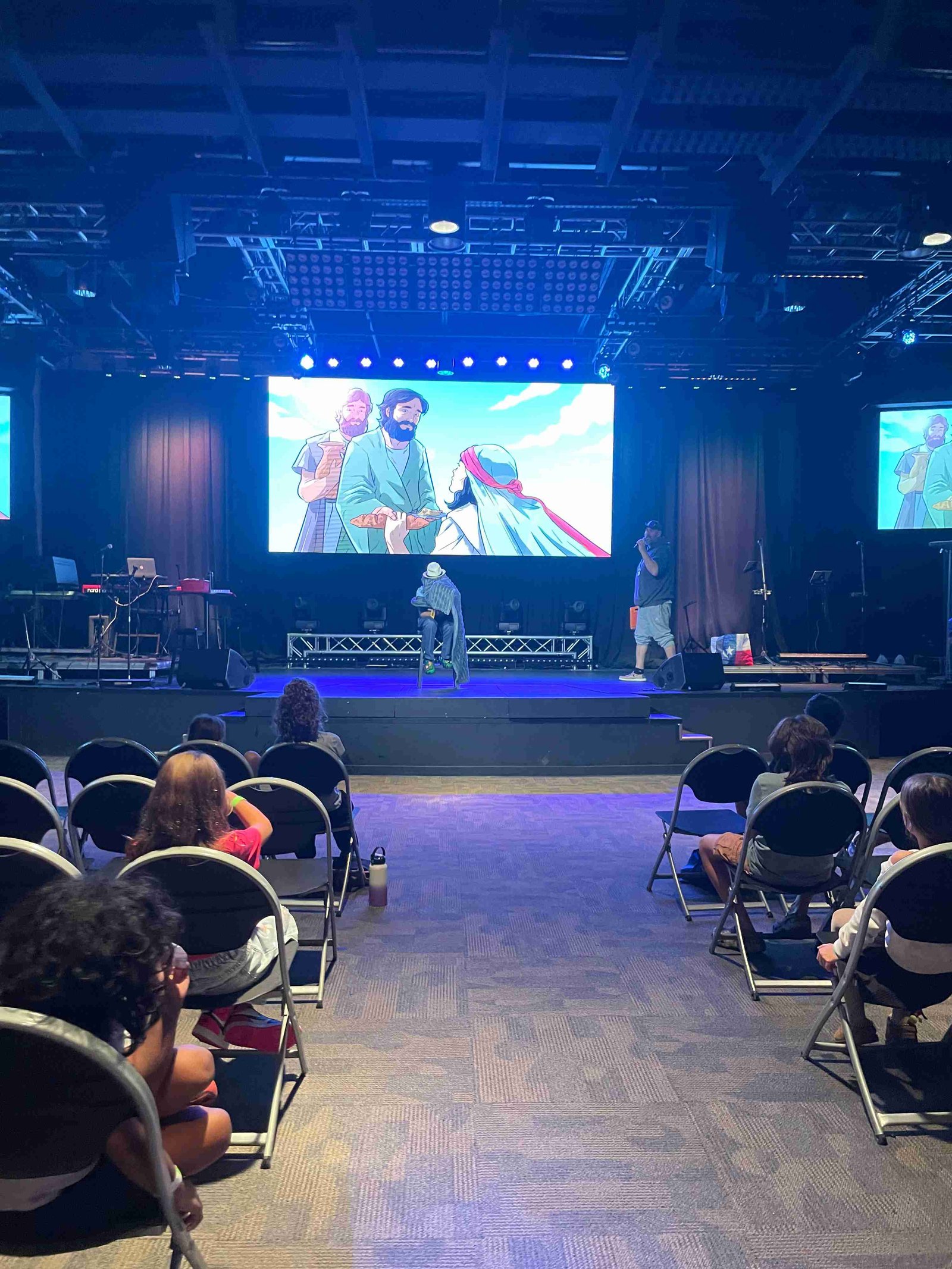 Biblical cartoon animation shown on large screen