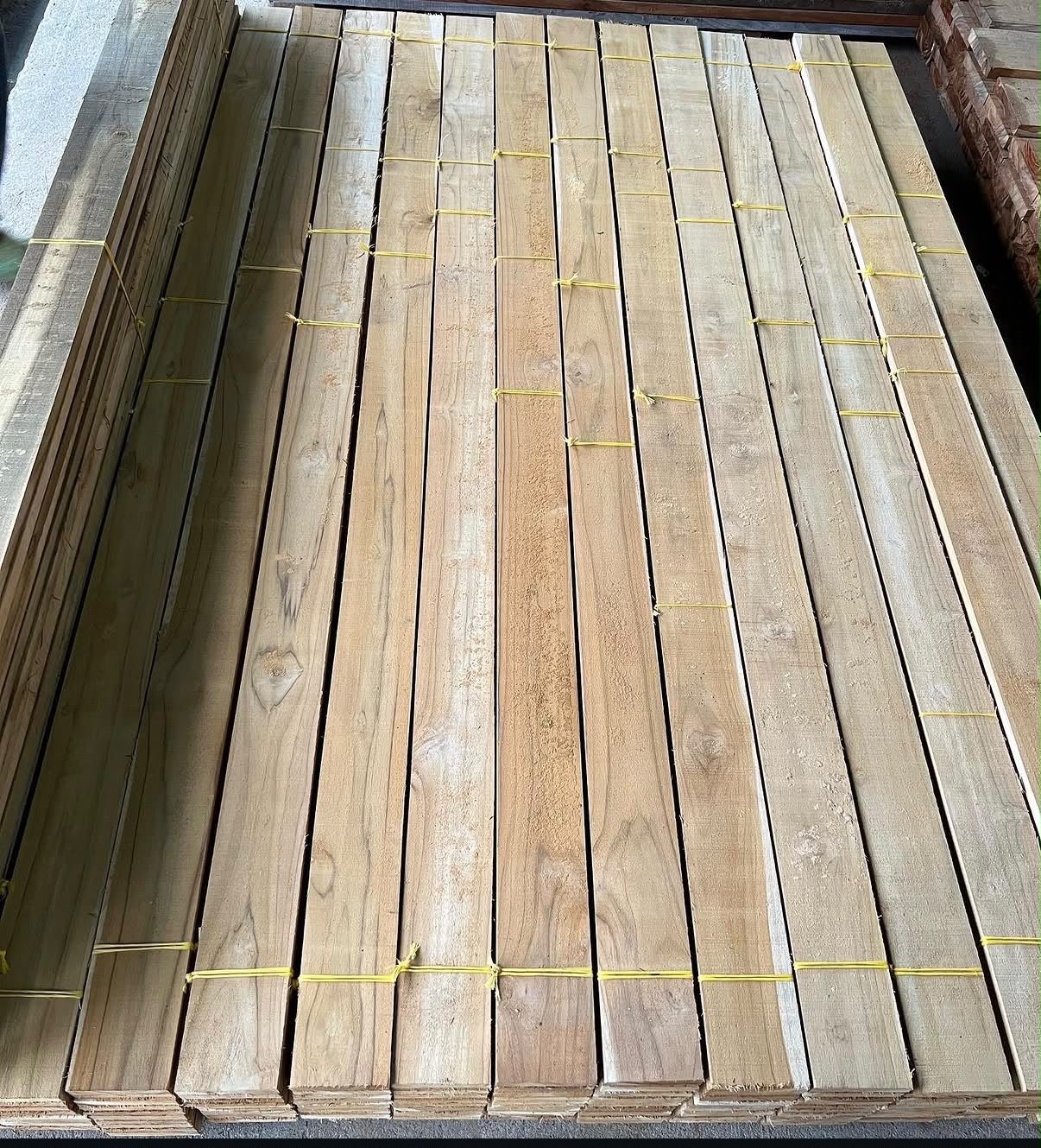 Tropical hardwood boards stacked for selection