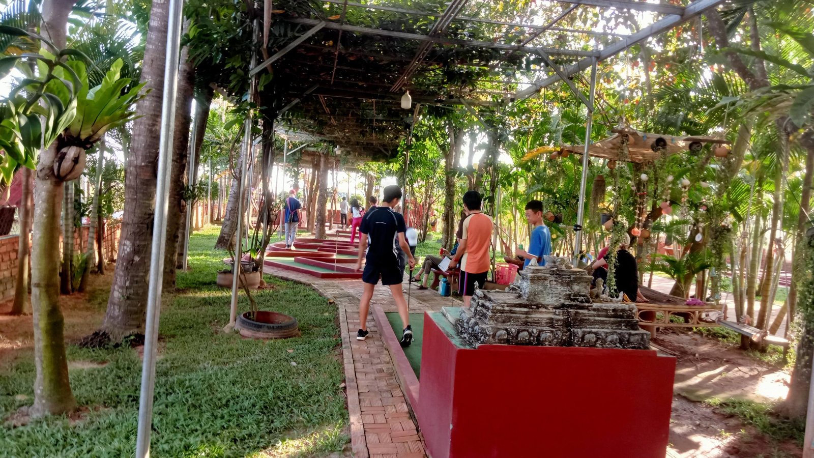 Shaded pergola with Khmer temple replica
