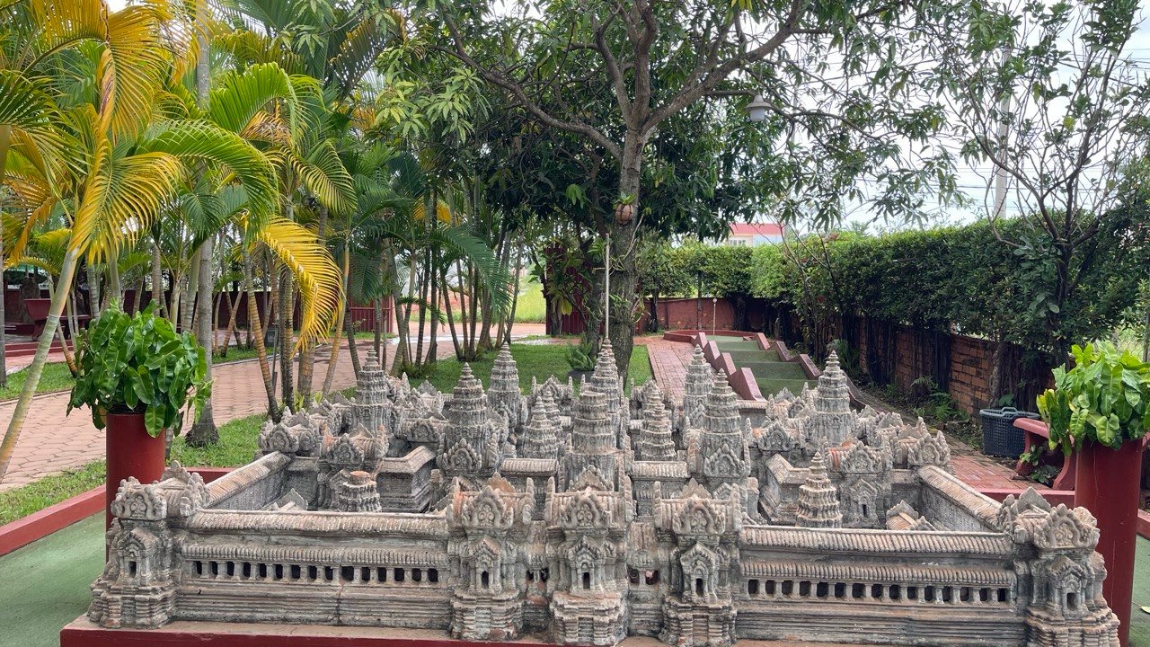 Intricate Angkor Wat temple model with palm trees