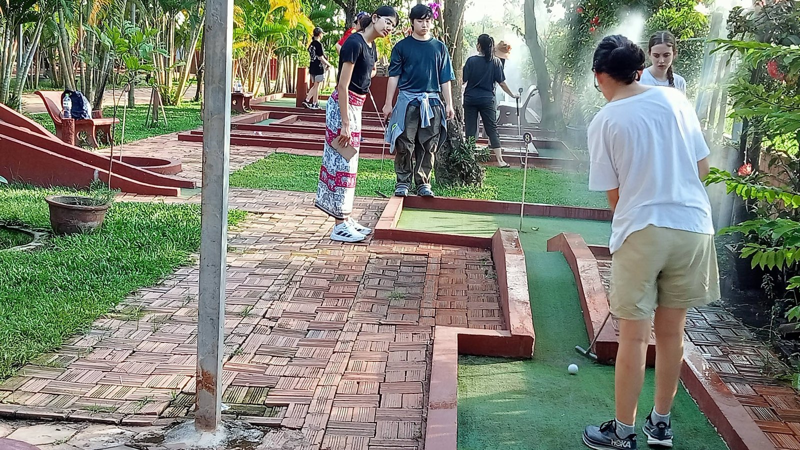 Players putting on the green