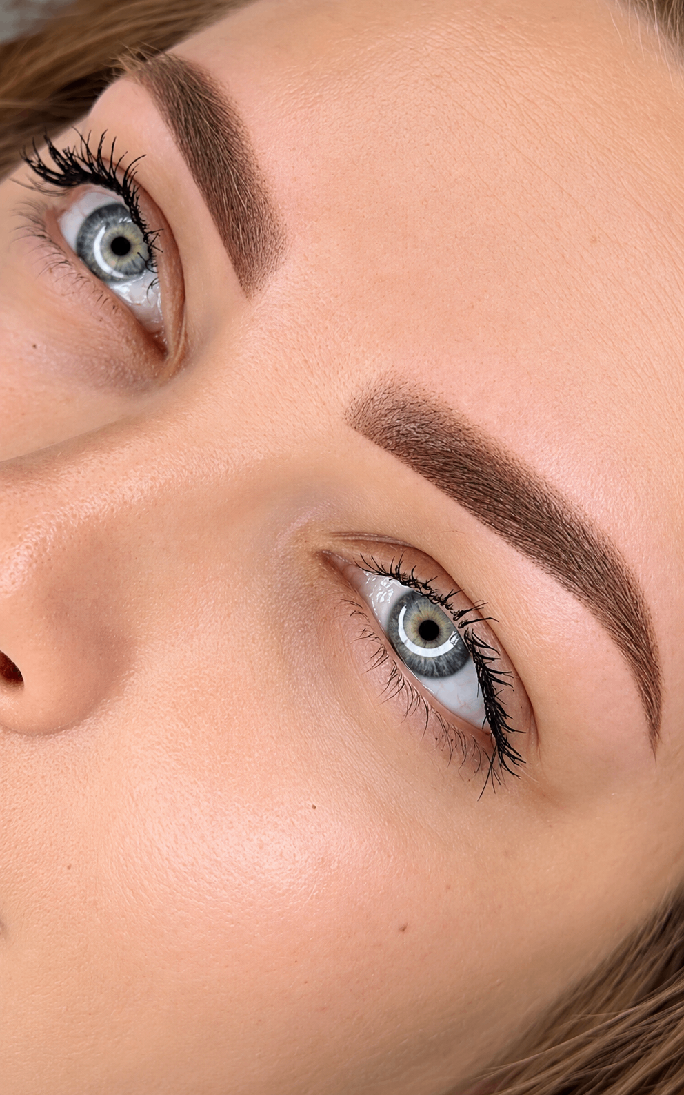 Healed semi-permanent brows with soft powder finish