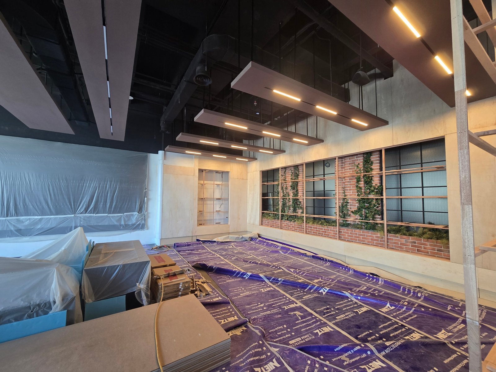 Decorative ceiling panels and feature wall installation in progress at GD Properties KLCC commercial fit-out