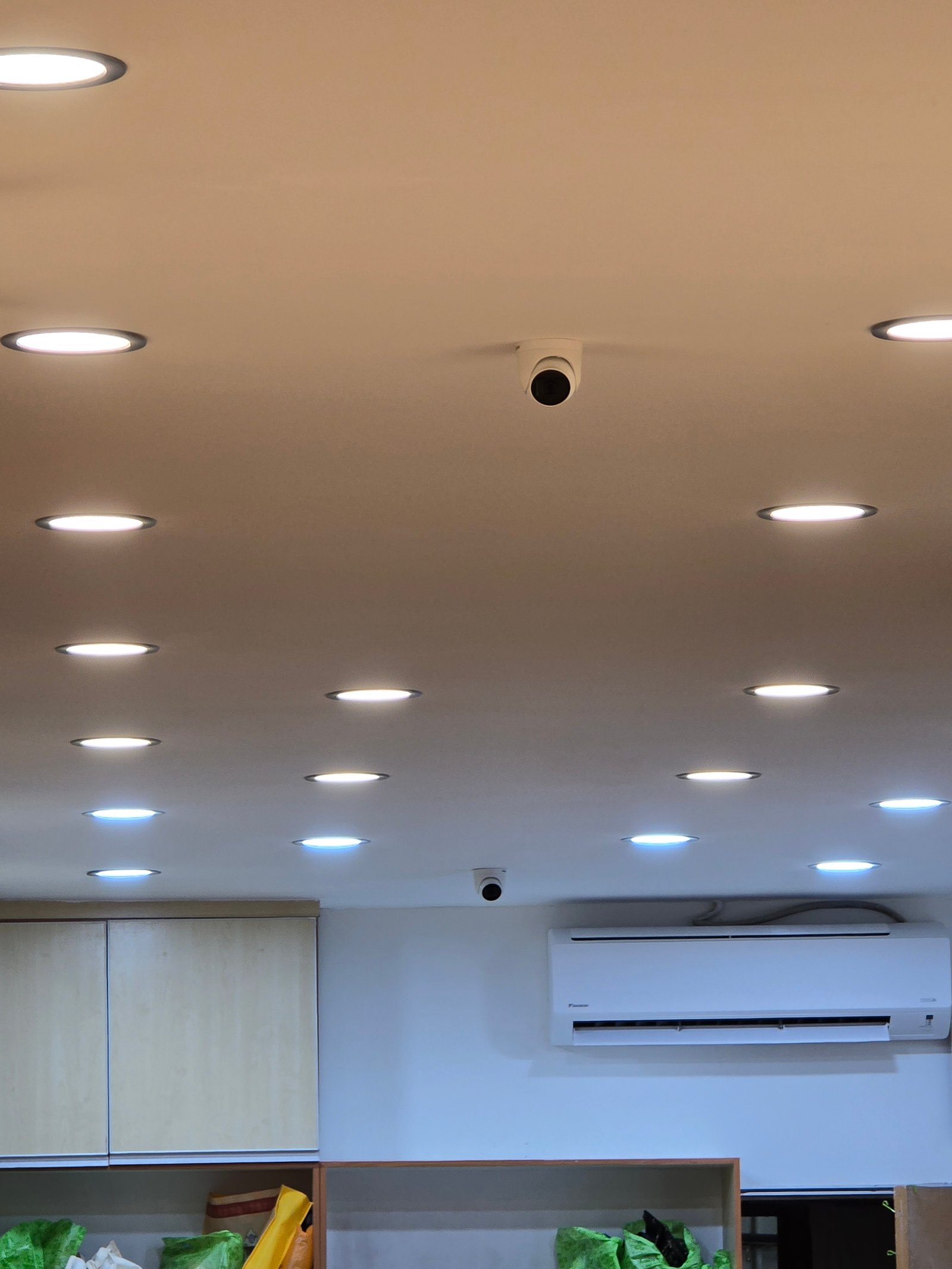Professional ceiling with warm LED downlights and wall cabinets at Arianaaz Karentsa Boutique