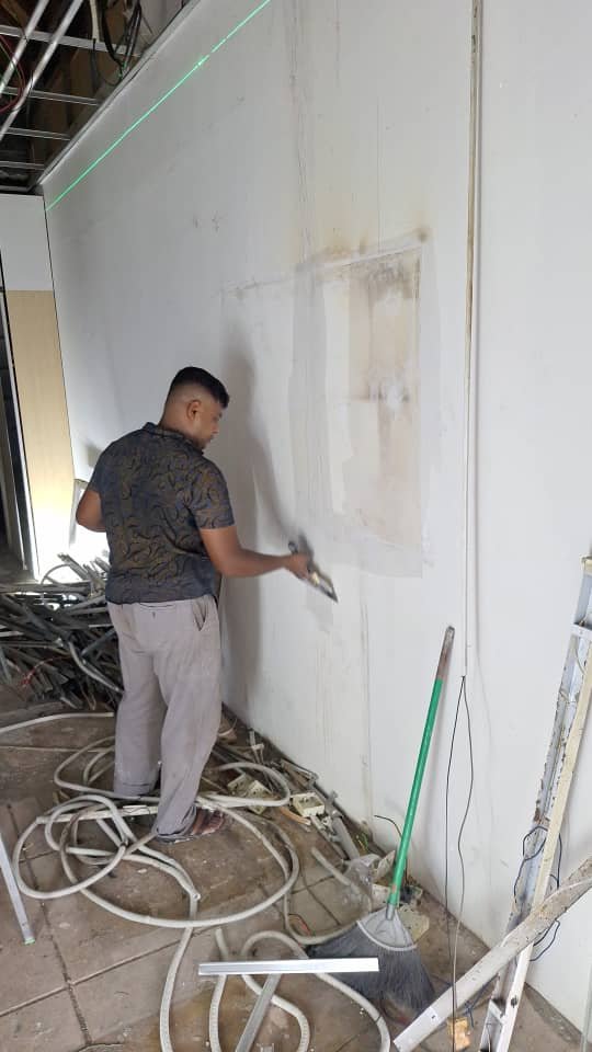 Wall surface preparation and plastering at Arianaaz Karentsa Boutique before painting