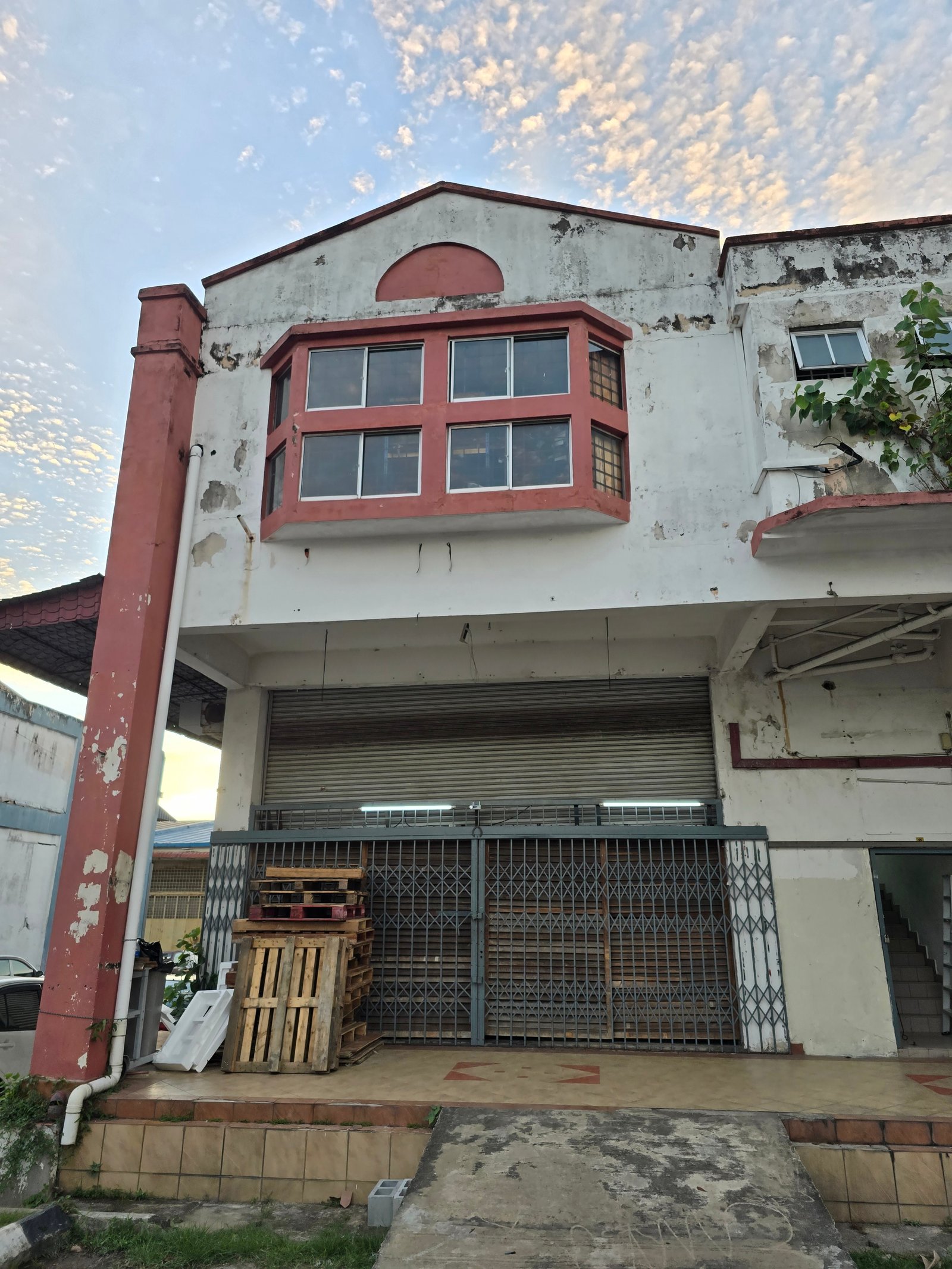 Before Industrial Painting transformation by Tresman Painting — Funzy Global Warehouse — Exterior Renovation