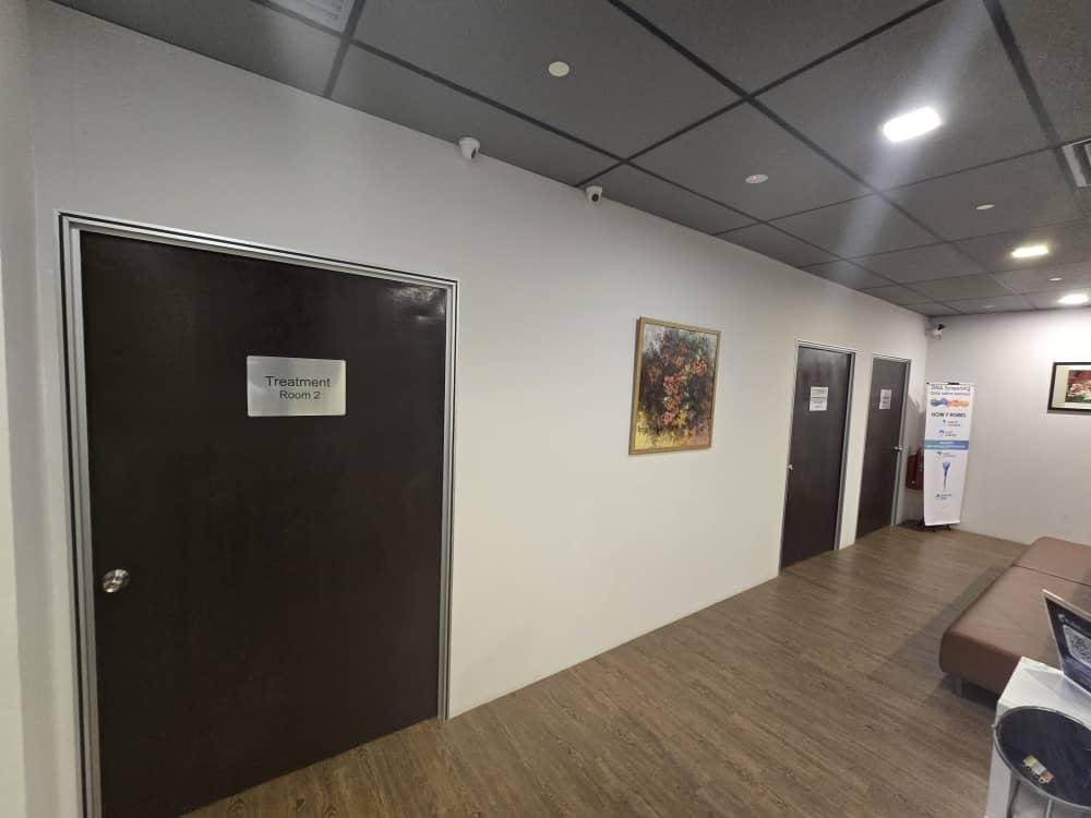 Corridor at KLEM Clinics KL Eco City with treatment room doors and professional white painted walls