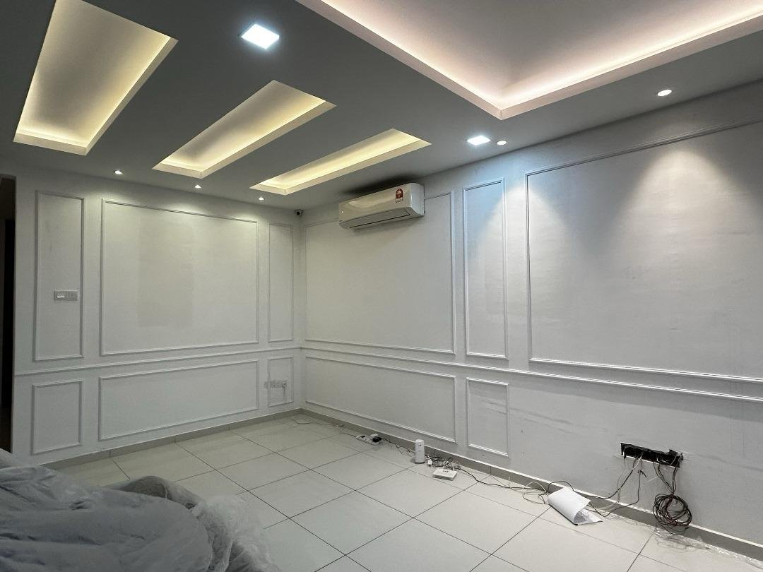 KLEM Clinics fit-out room with completed recessed LED ceiling detail and white wall panelling under installation