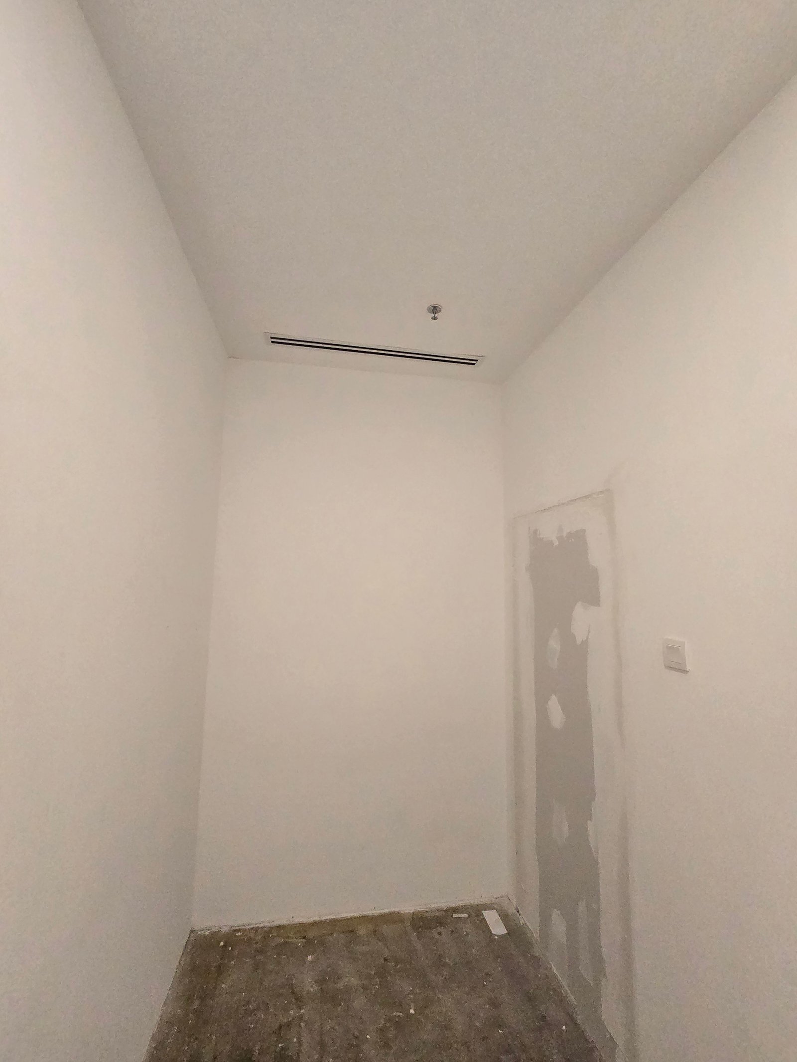 Clean white painted room at GD Properties KLCC Showroom with concealed linear AC vent