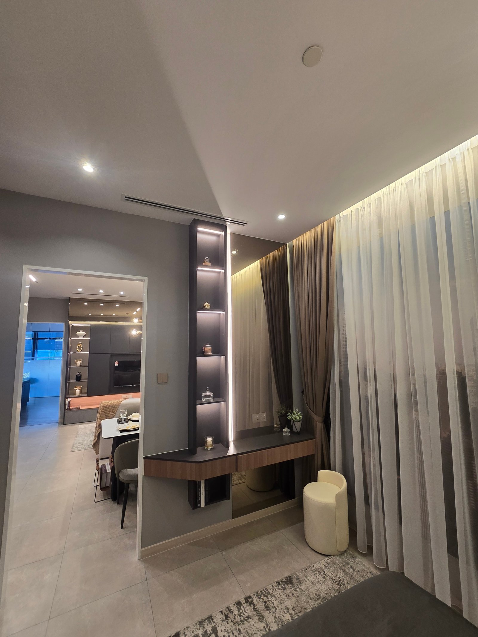 Premium showroom bedroom at GD Properties KLCC with backlit display shelving and luxury curtains