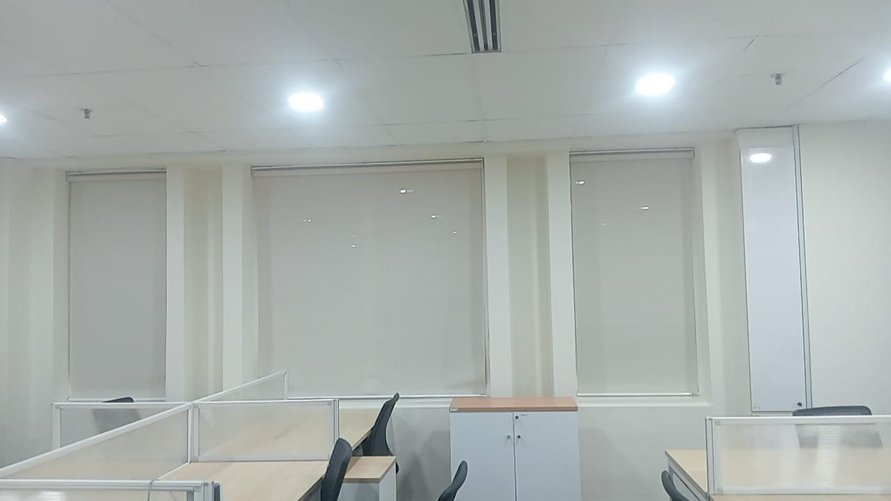 Open-plan office workstations at GD Properties Megan Avenue II with roller blinds and fresh white paint