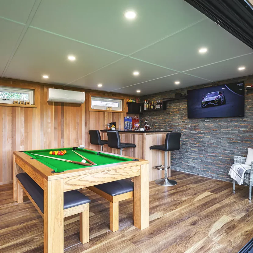 Bright studio garden room with wooden finishes suitable for art or music