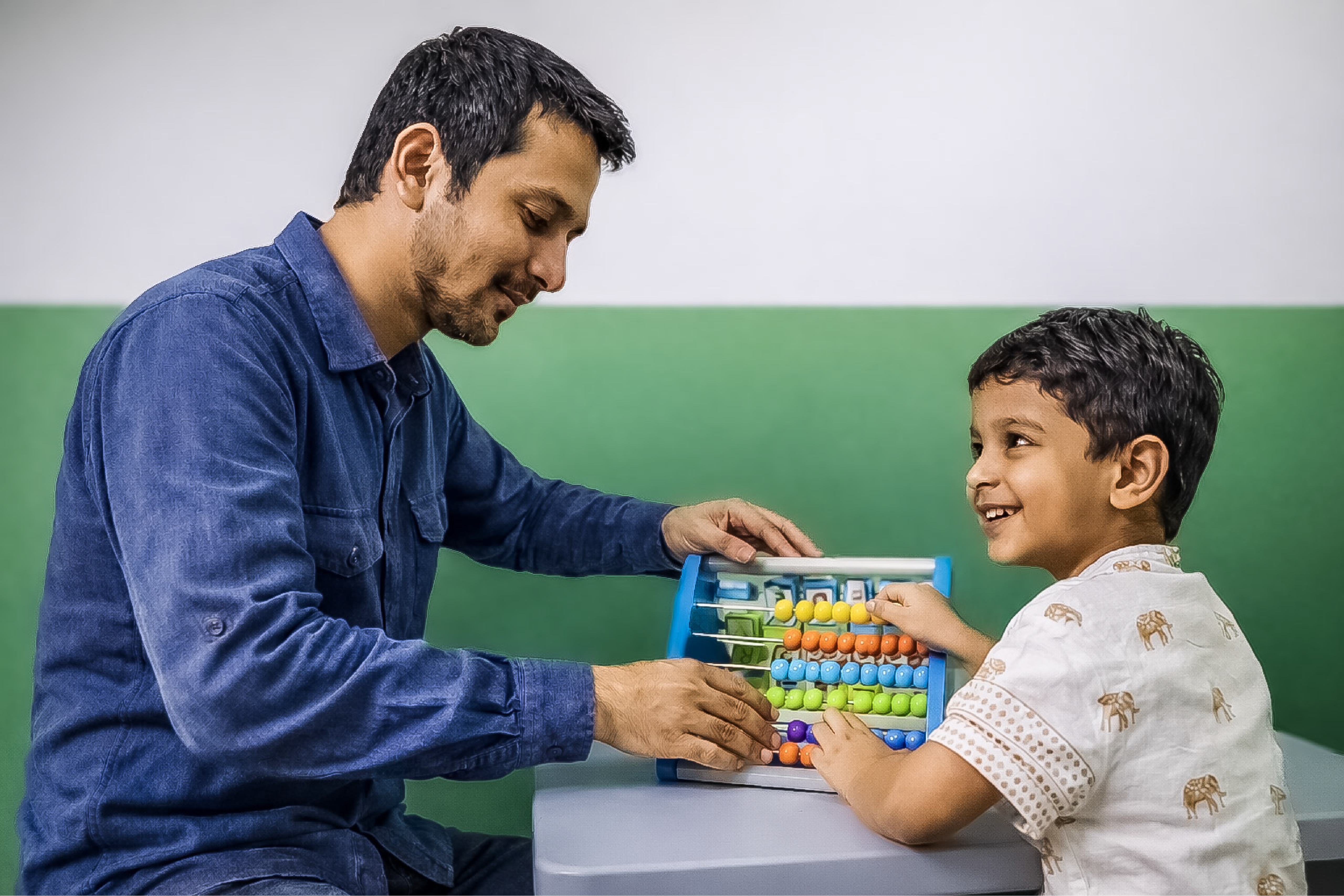 Therapist and child working with counting tool