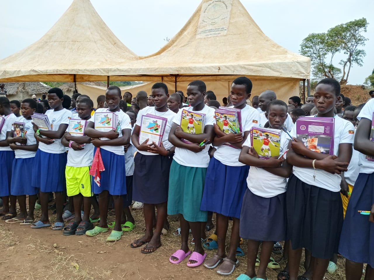 Community members working with agricultural materials in field