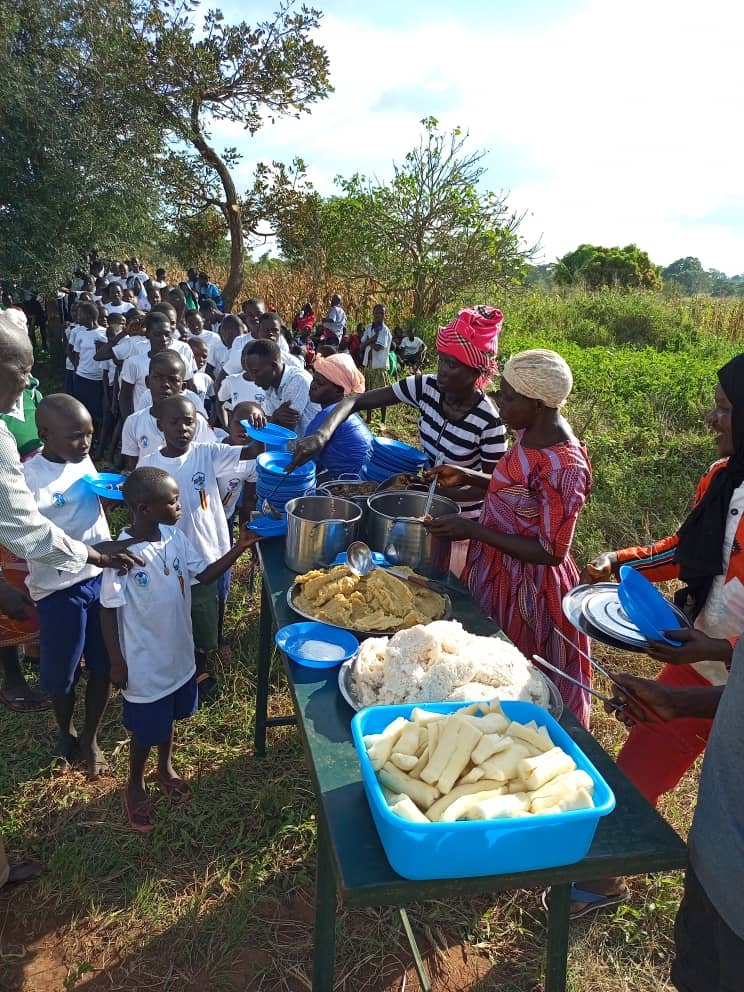 Beneficiaries receive meals at a gathering of Kango Kids