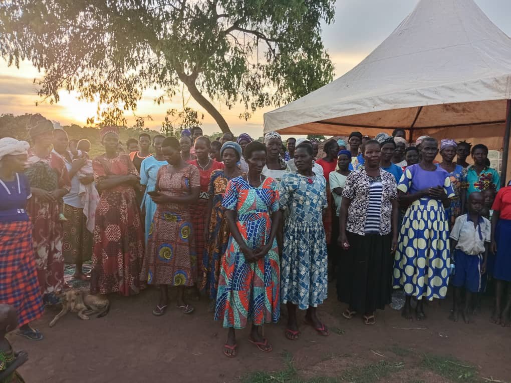 Large group of women and community members gathered for Kango Kids community event