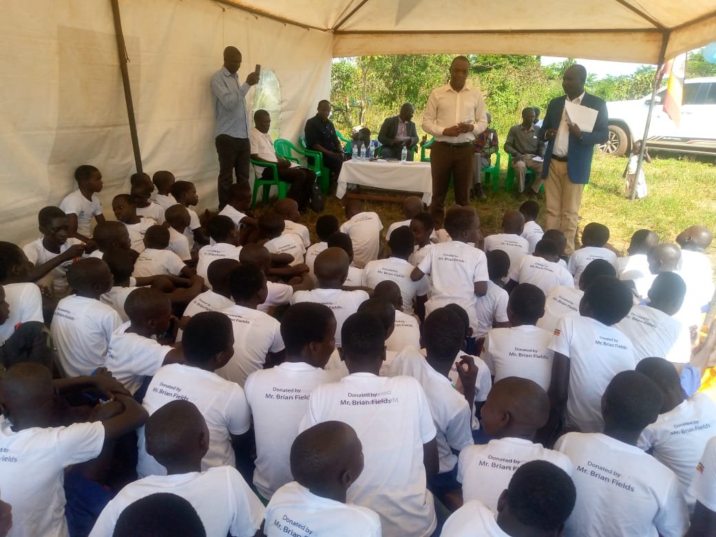 Community members gathered in a tent for spiritual fellowship and prayer