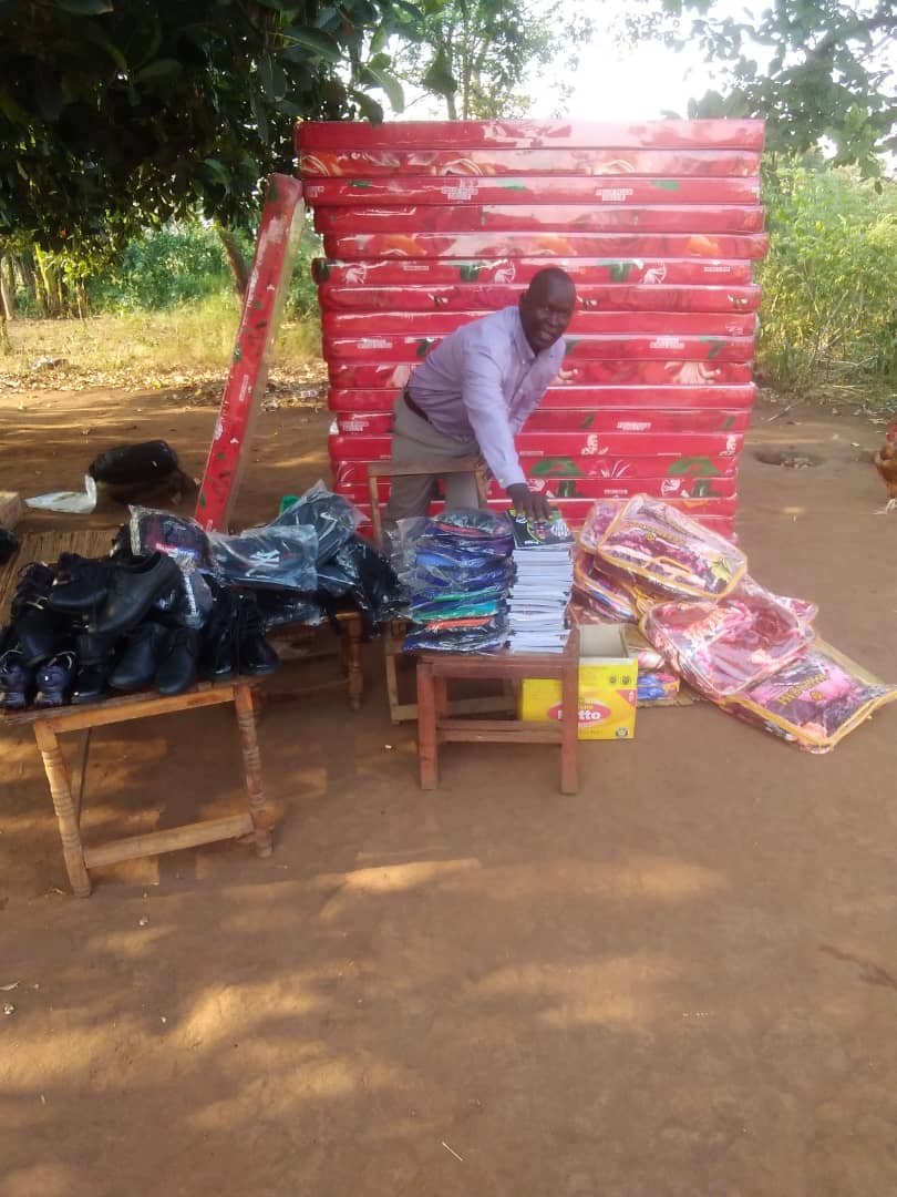 Kango Kids Foundation CEO handing over Mattresses to best performing beneficiaries