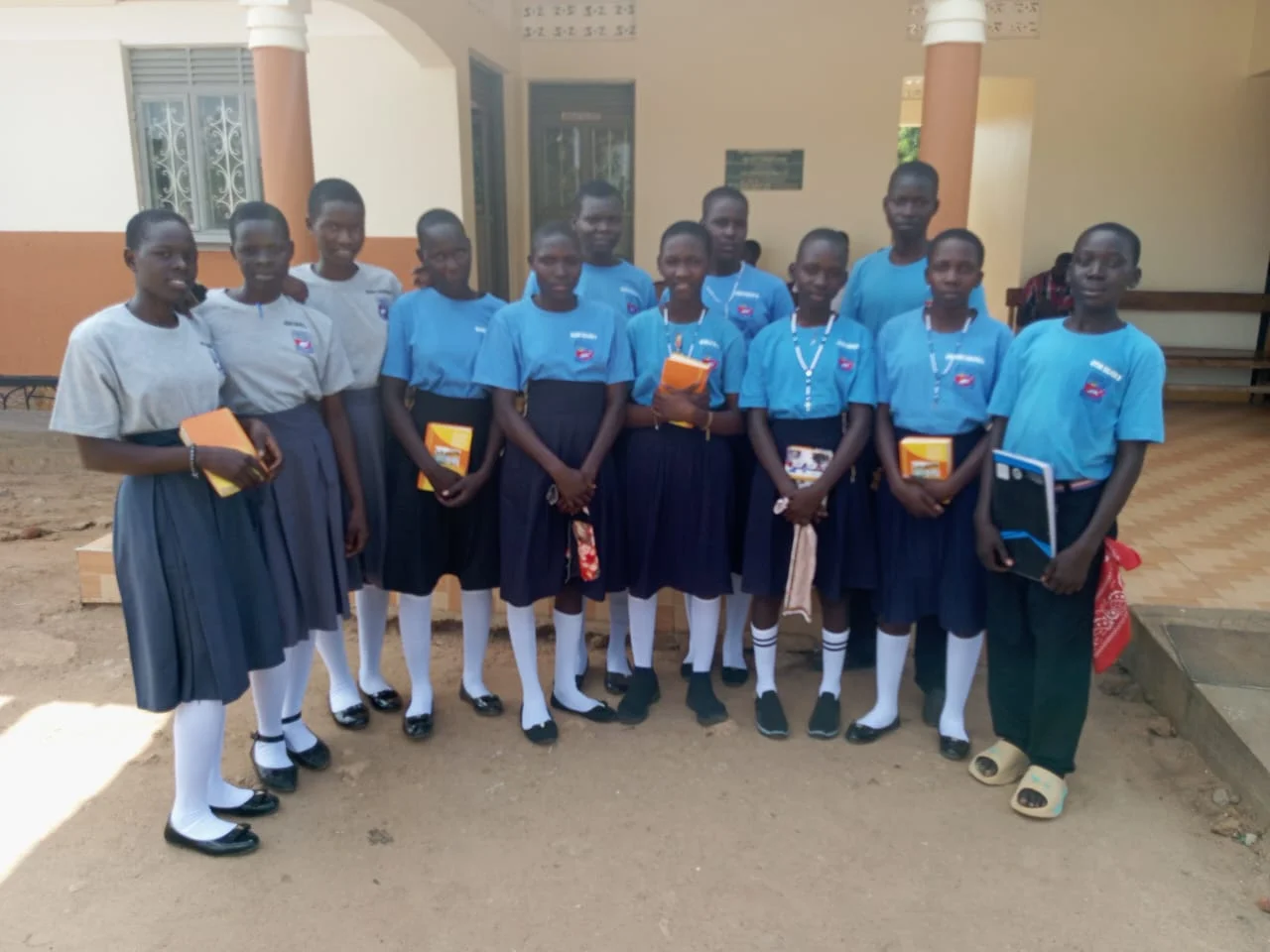 Beneficiaries Pose for a group photo after receiving their bibles under our spiritual growth program