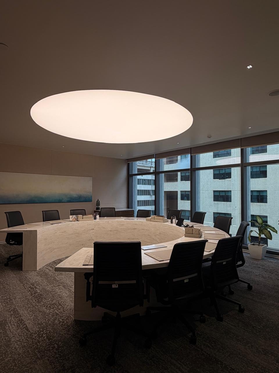 Premium boardroom lit by a circular ceiling light at BIA campus