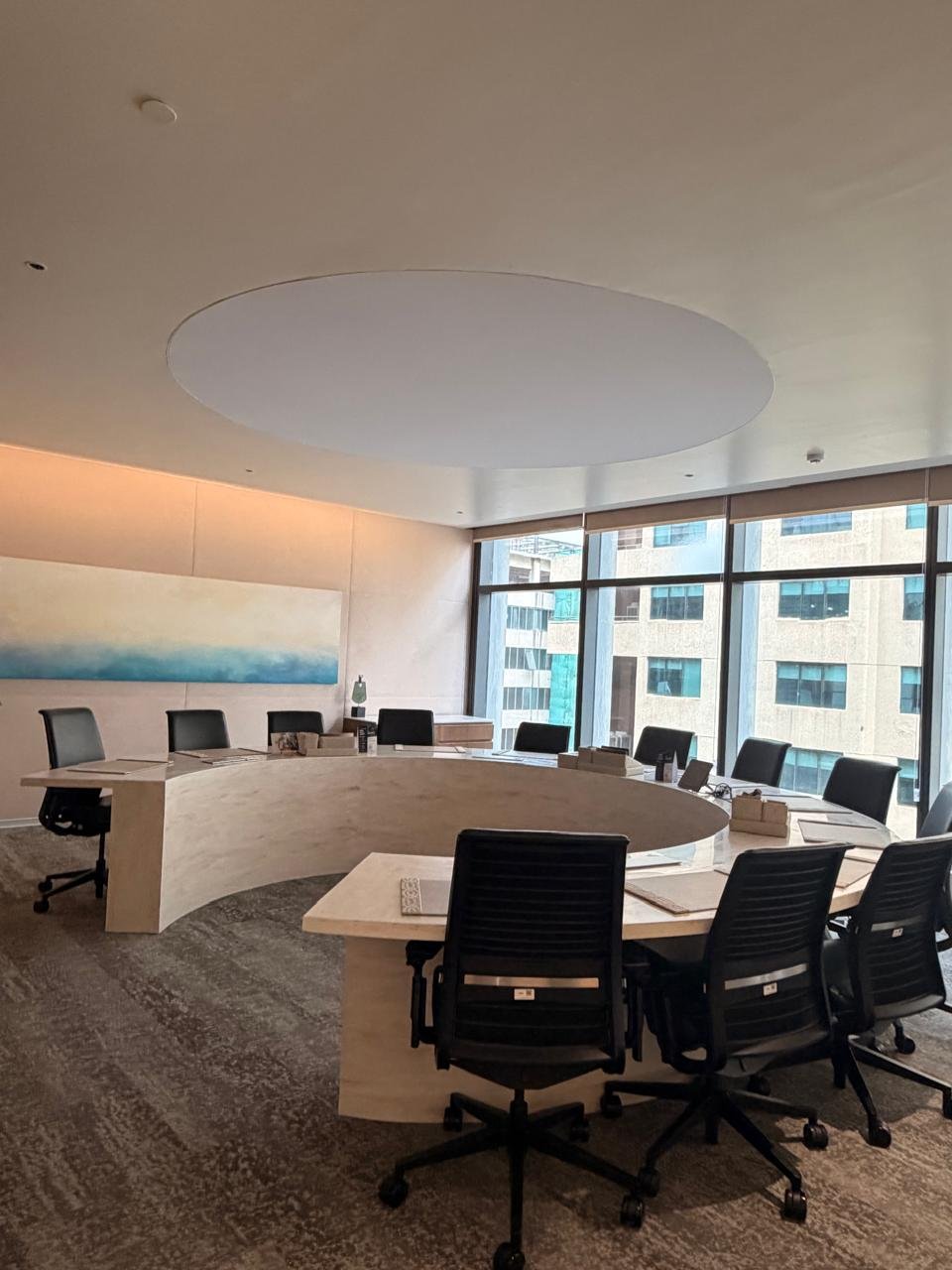 Spacious BIA meeting room with panoramic windows and black chairs